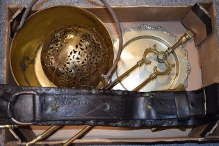 A collection of items to include an antique brass jam pan, an early horses harness attachment, brass