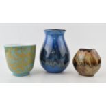 Poole Pottery vases to include a bulbous vase in blue glaze, a similar short vase in blue and orange