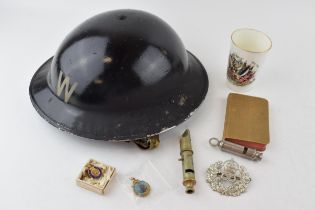 A collection of items to include an A.R.P Wardens helmet together with an A.R.P whistle together