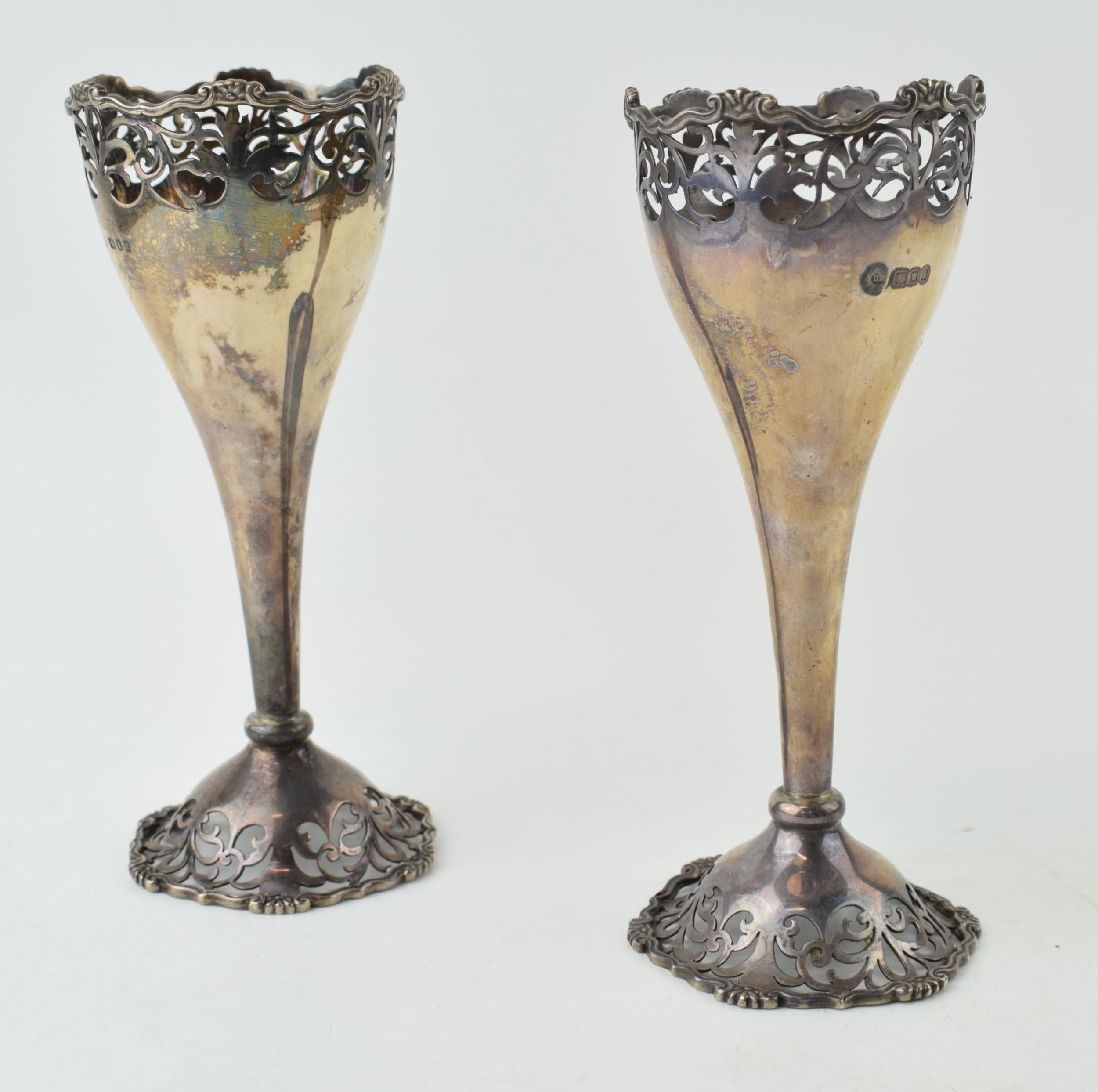 A near pair of Art Nouveau style vases hallmarked London 1920 and 1924. Height 16.5cm. Weight 209.