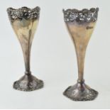 A near pair of Art Nouveau style vases hallmarked London 1920 and 1924. Height 16.5cm. Weight 209.