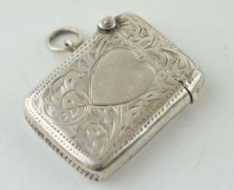 A ladies vesta case with heart motif and hand chased hallmarked Birmingham 1939. Weight 16 grams. In