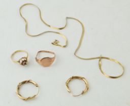 A collection of 9ct gold items to include a necklace and pair of earings together with two rings,