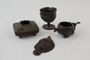 A collection of oriental miniature items to include water pots, 2 bronze and 1 pewter, together with