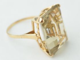 9ct gold dress ring with smokey coloured stone, emerald cut, gross weight 7.1 grams, size R.