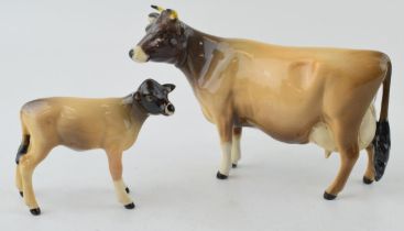 Beswick Jersey Cow (nip to horns) with a Calf 1249D (2). In good condition with no obvious damage or