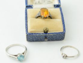 A diamond and white metal ring, 9ct gold and blue topaz (or paste) together with a 9ct and silver