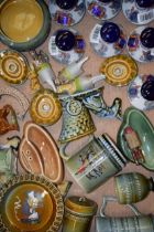 A good collection of Wade and Irish Wade to incldue animal bottle tops, decanters, tankards,