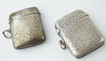 A pair of silver vesta cases, Chester 1904 and Birmingham 1896, 53.6 grams combined.