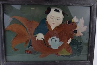 Vintage Oriental painting on glass depicting a man holding a carp. Painted on glass from reverse.