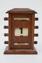 Vintage perpetual calendar with scrolling days, months and dates, 16.5cm tall. In good condition,