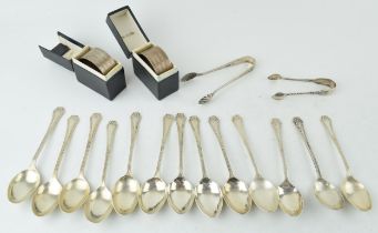 A collection of silver spoons. Hallmarked Birmingham. Together with two boxed napkin rings and two