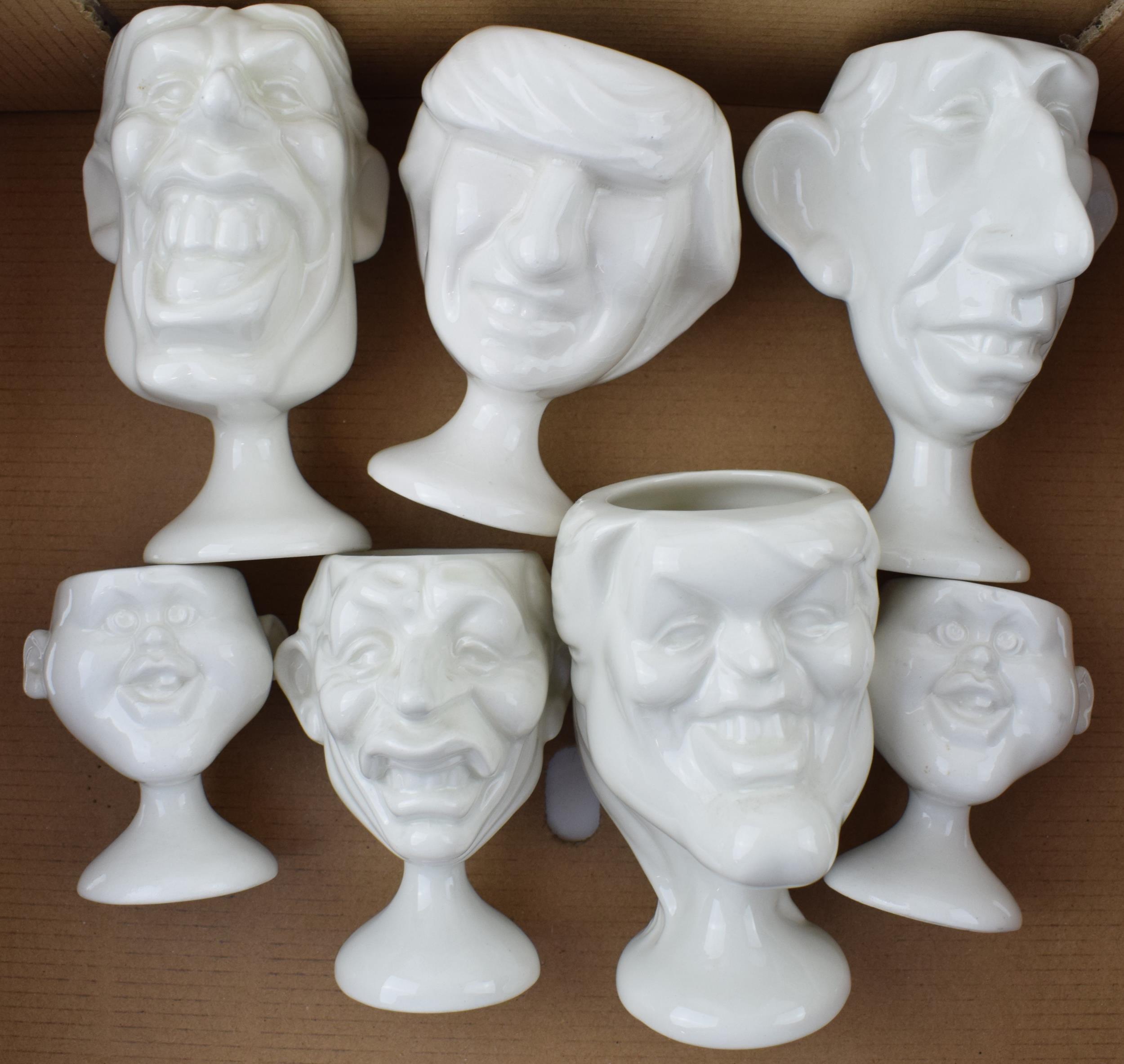 A collection of Fluck and Law Spitting Image egg cups to include Charles, Diana, William as a