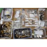 A large collection of watch parts to include bezels, quartz movements, watch backs and links. A good