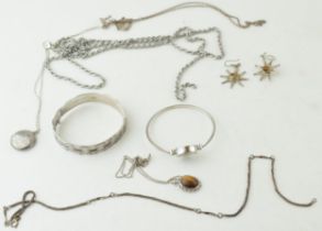 A collection of silver items to include a bangle, pendant and necklace (41.5 grams) together with