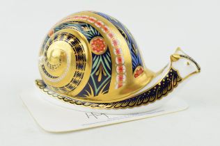 A Royal Crown Derby paperweight, Garden Snail, this is number 3,483 of a limited edition of 4,500,