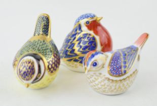 Three Royal Crown Derby paperweights, Robin, 6.7cm high, date code for 1998 (LXI), gold stopper