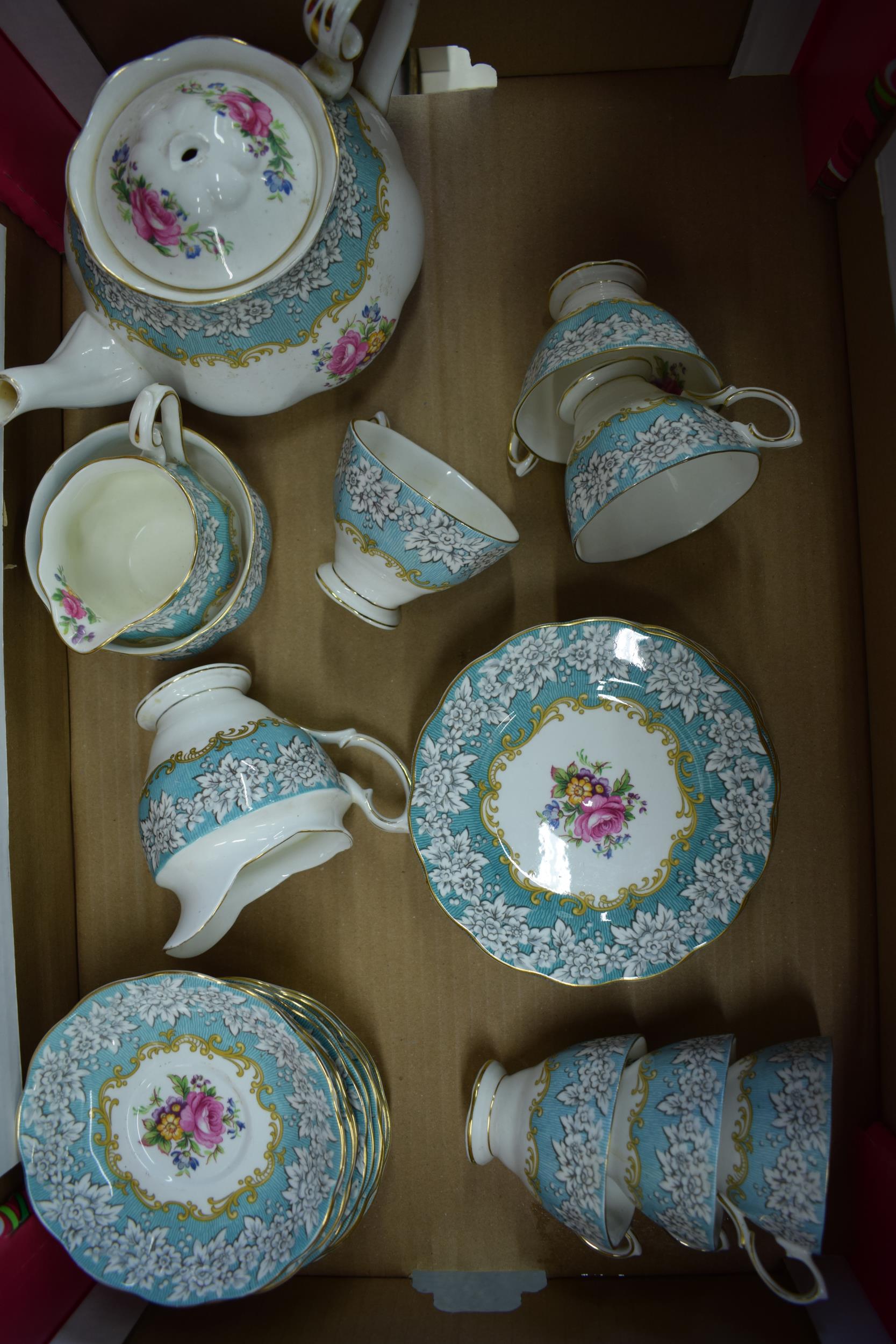 Royal Albert tea ware in the Enchantment pattern to include a teapot (finial af), 6 trios, a milk