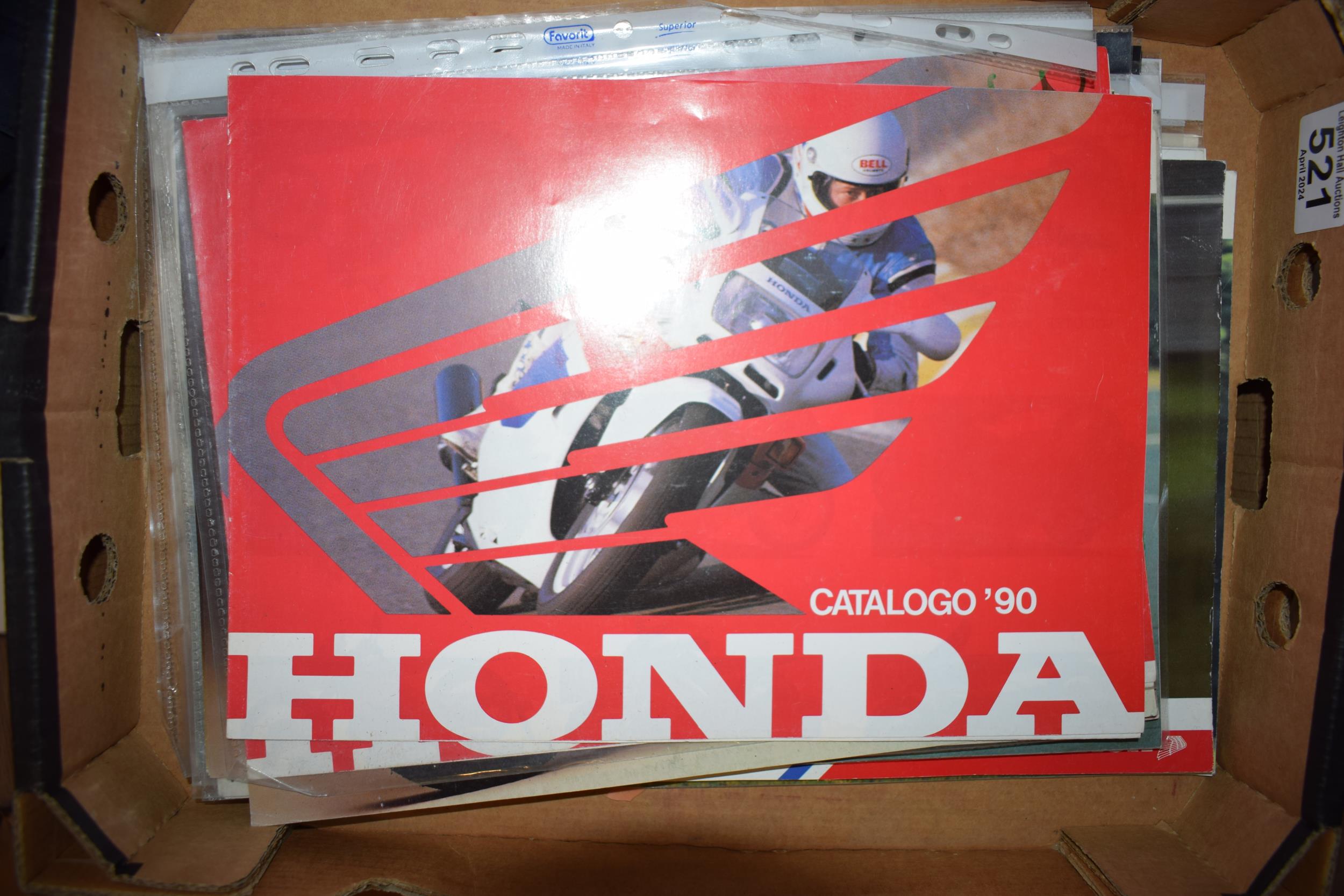 A collection of A4 dealership sales brochures for motorcycles of the 1980s and 1990s to include