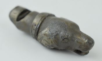 A pewter dog whistle depicting a spaniel or huntinging / shooting dog with collar. Whistle