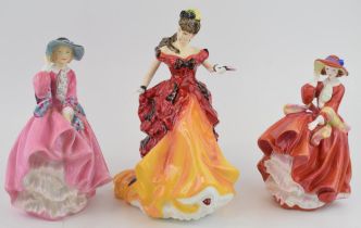 Royal Doulton figure 'Belle' HN 3702, 'Top O' The Hill' HN 4778, together with 'Top O' The Hill HN