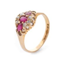 An 18ct yellow gold ladies ring set with three rubies and diamonds. Size P 1/2. Gross weight 3.7