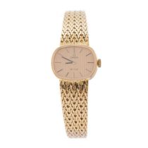 A ladies Omega De Ville 18ct gold wristwatch. Goldtone dial with applied baton markers. 18ct gold