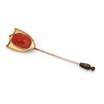Victorian 9ct gold shield-shaped stick pin with large coral cameo, gross weight 11.4 grams, 10cm