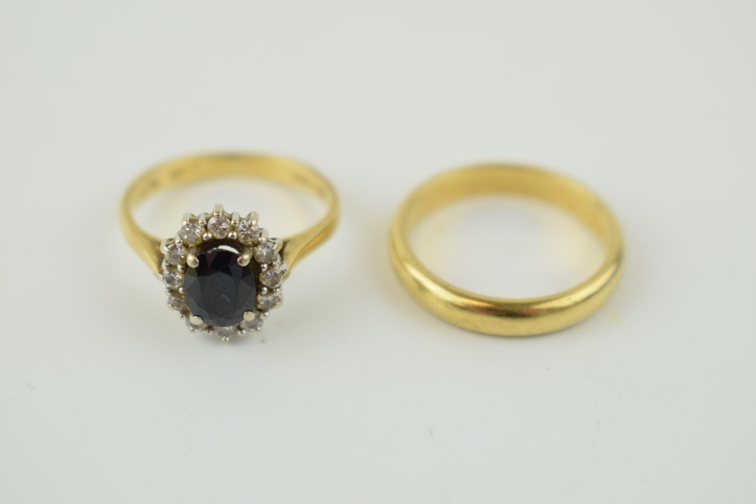 An 18ct yellow gold wedding band, 3.6 grams, size K, with an 18ct gold sapphire and diamond - Image 2 of 4