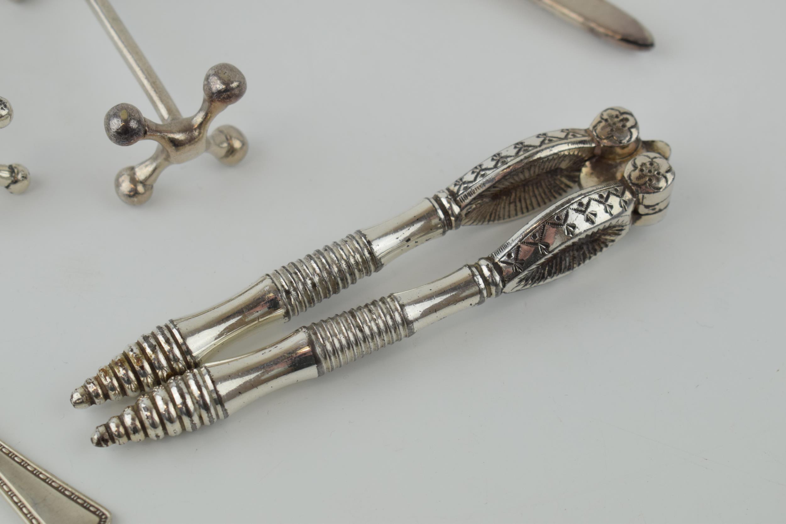 A collection of silver plated items to include knife rests, a nutcracker set and others. - Image 2 of 4