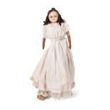 Wax head antique doll in white dress with leather arms. Height 59cm. c1840. In good antique