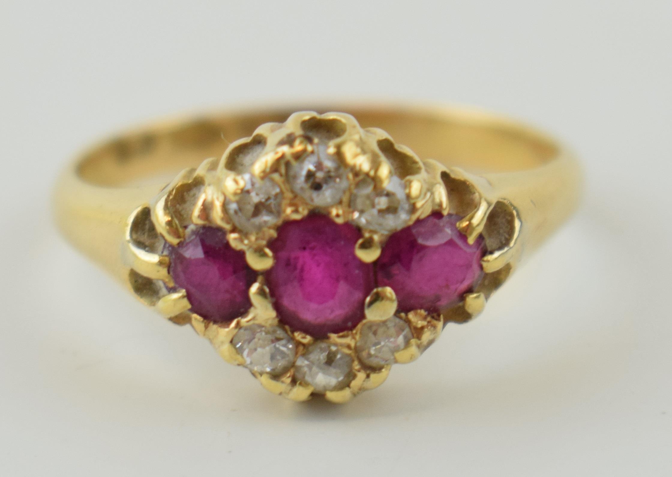 An 18ct yellow gold ladies ring set with three rubies and diamonds. Size P 1/2. Gross weight 3.7 - Image 2 of 3