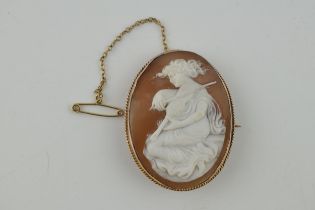 9ct gold cameo brooch, a lady with a violon, 11.1 grams, metal pin and safety chain, 48mm tall.