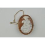 9ct gold cameo brooch, a lady with a violon, 11.1 grams, metal pin and safety chain, 48mm tall.