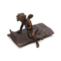 Ernest Justin Ferrand (French 1846-1932) a small patinated bronze figure of cupid seated on a