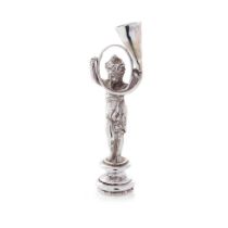 A late 19th century silver figural desk seal, import marks for Berthold Muller, 9cm tall.