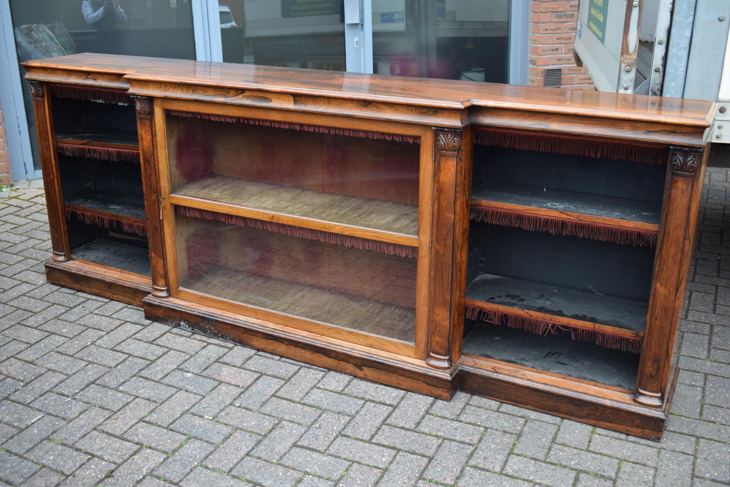 An oversized 19th century mahogany breakfront sideboard credenza with central glazed cabinet,