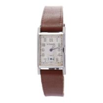 Art Deco gentleman's Jaeger LeCoultre wristwatch. Rectangular off-white dial with luminous numbers