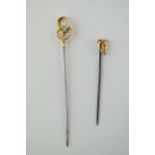 A pair of 9ct gold headed stick pins, one set turquoise, both on metal pins, gross weight 2.8 grams,