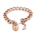 A 9ct yellow gold bracelet with heart shaped padlock. weight 19.4 grams In good original condition.