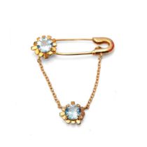 9ct gold 'Zandra Rhodes' blue topaz pin brooch with drop chain, set further blue topaz, with box and