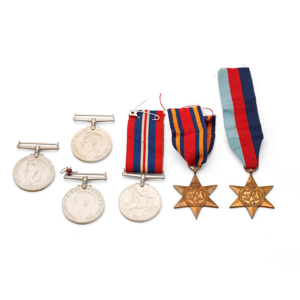 Two groups of WWII medals to include The Defence Medal (2) one with original ribbon, 1939 - 1945