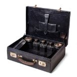 A leather cased travelling case to include 6 silver topped jars of varying sizes and forms with