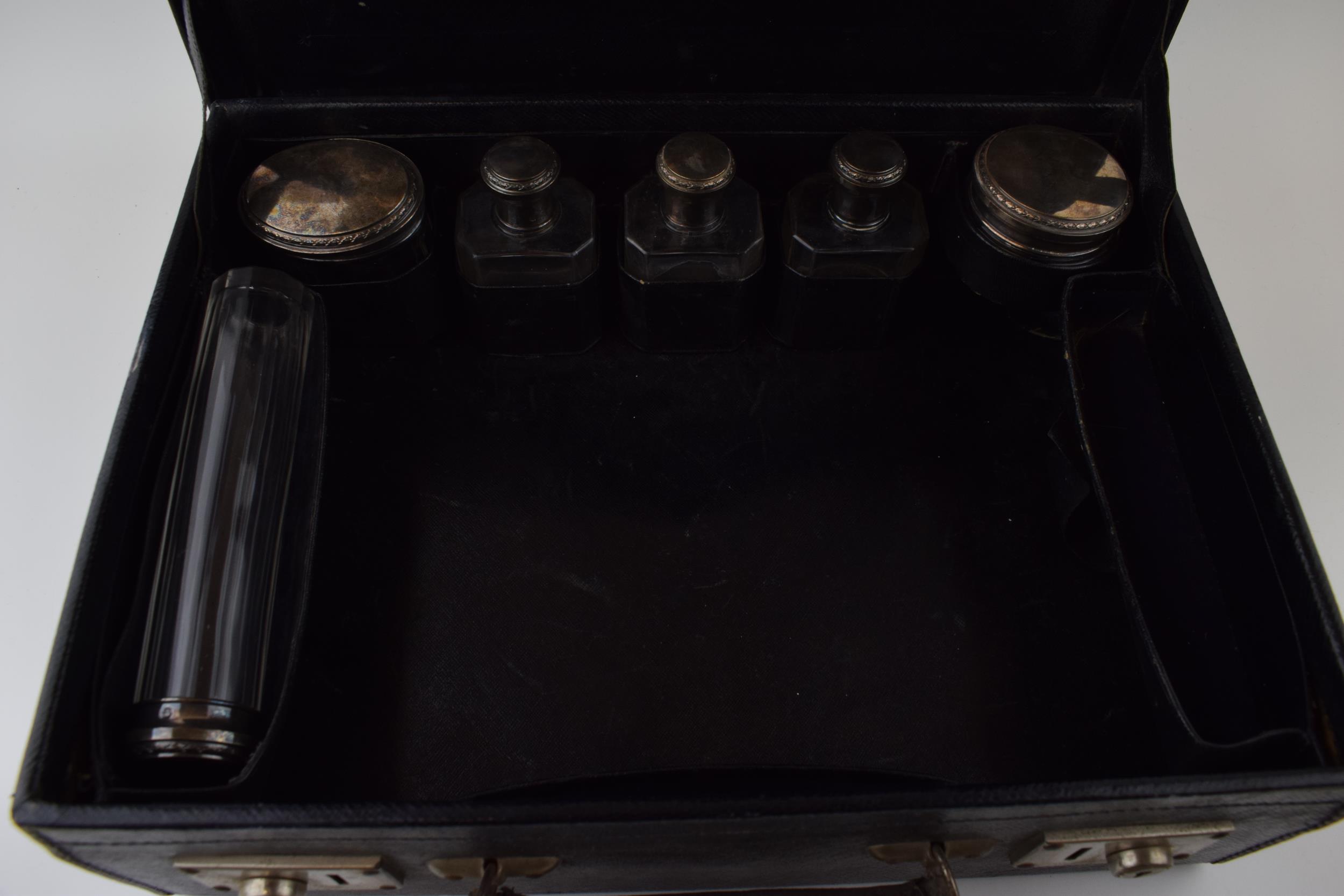 A leather cased travelling case to include 6 silver topped jars of varying sizes and forms with - Image 3 of 5