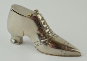 A novelty silver plated vesta case in the form of a shoe, dated 1910, 7cm long.