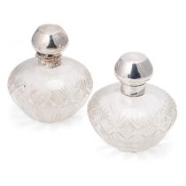 A pair of matching silver topped cut glass perfume bottles, Birm 1923, Levi & Salaman (2), 10cm