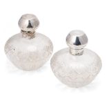 A pair of matching silver topped cut glass perfume bottles, Birm 1923, Levi & Salaman (2), 10cm