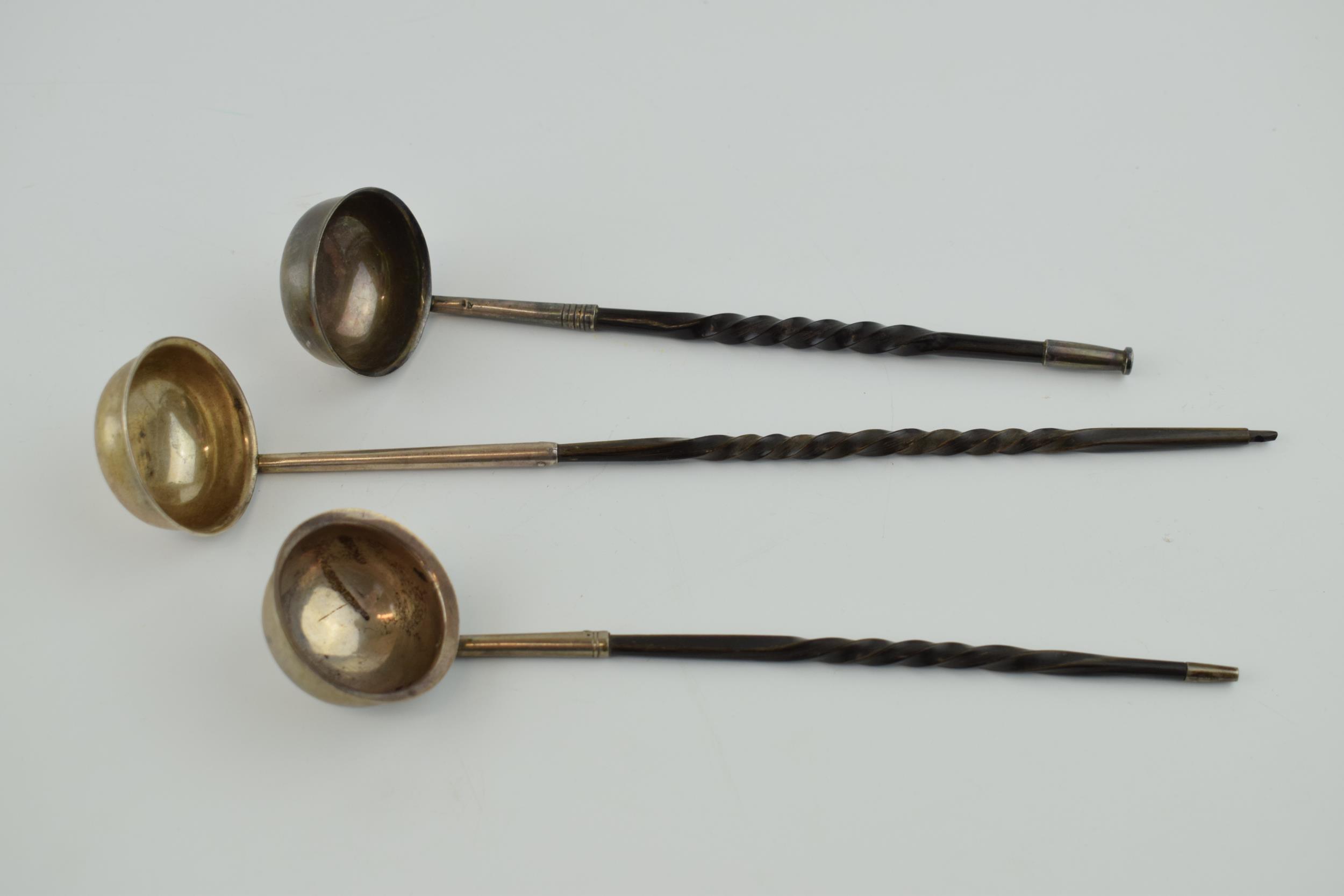 A trio of silver toddy ladles with twist effect handles, unmarked, longest 25.5cm (3). 1 with hole - Image 2 of 4