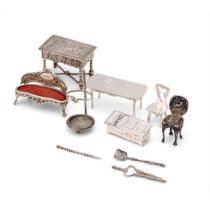 A collection of miniature silver furniture to include a grand sofa, Birm 1902, a .930 silver heavily