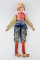 A boudoir doll in the form of a Dutch Lady in clogs. Silk clothes, composition head and hand painted